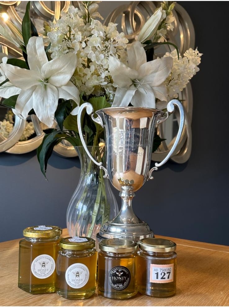 Swann's Garden honey jars with the beekeeping challenge cup