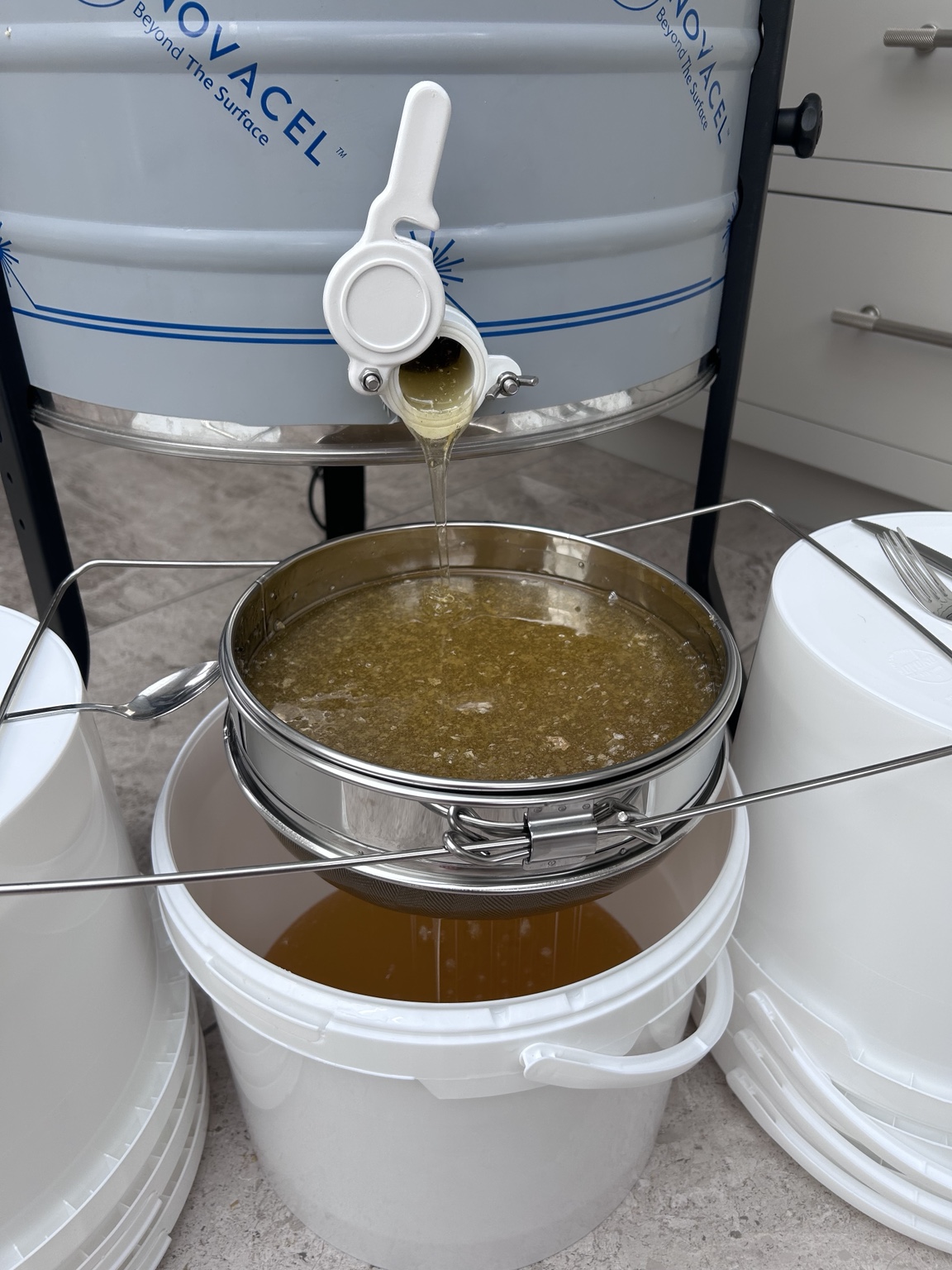 Fresh honey leaving the extractor before filtering