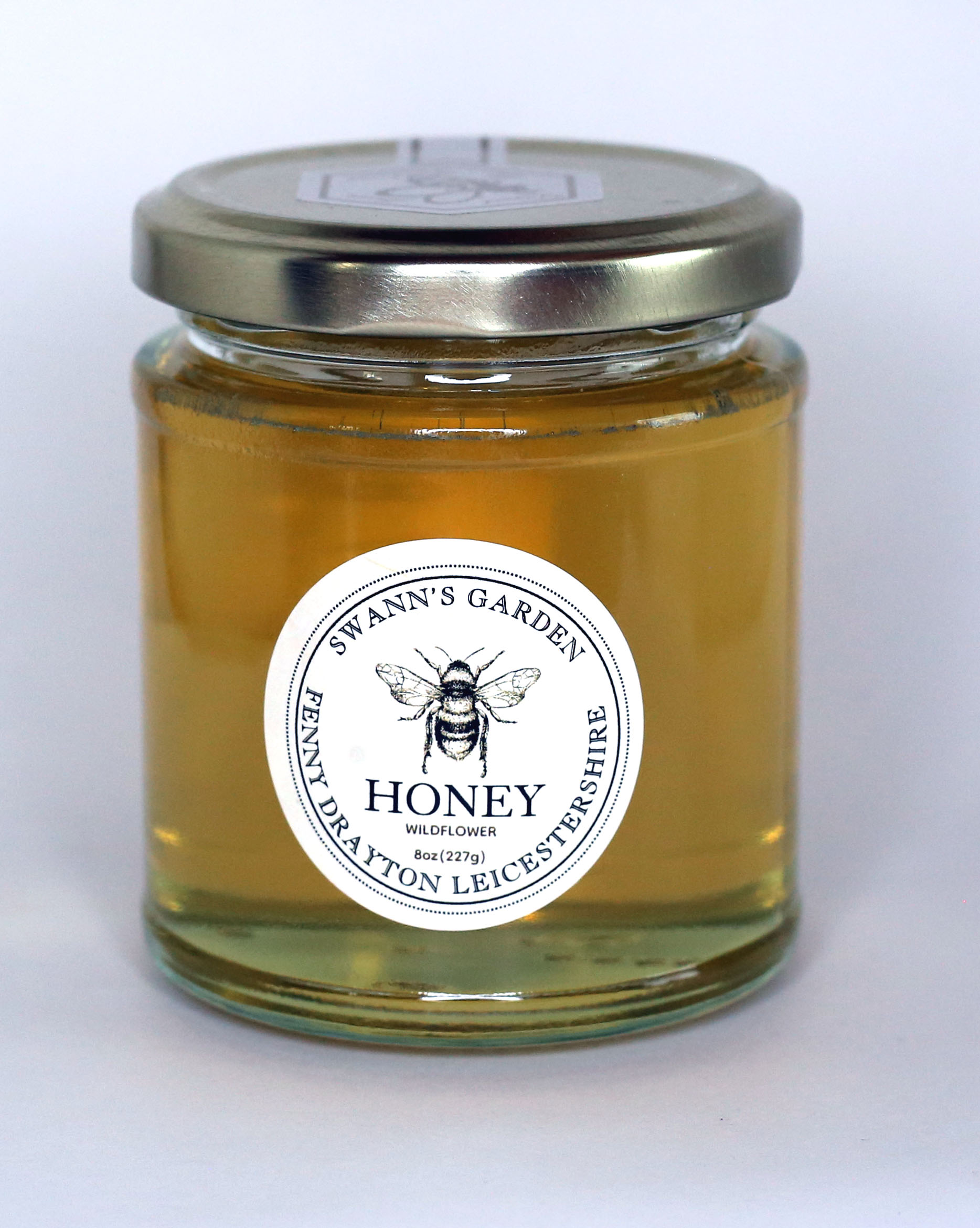8oz jar of Swann's Garden wildflower honey
